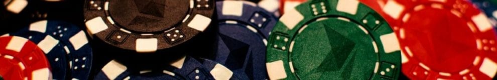 a pile of multi-colored poker chips