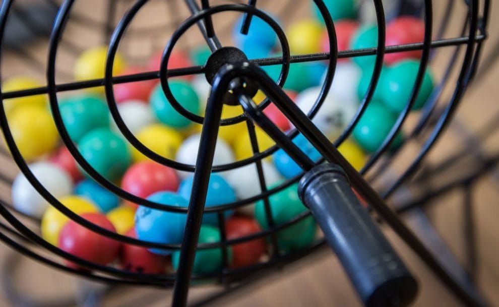 colorful bingo balls in a bingo cage