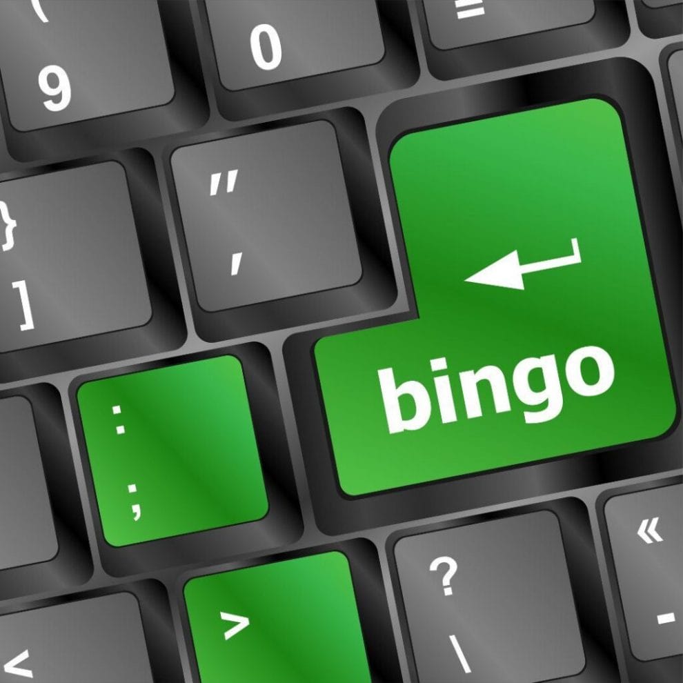 a green bingo button on a computer keyboard
