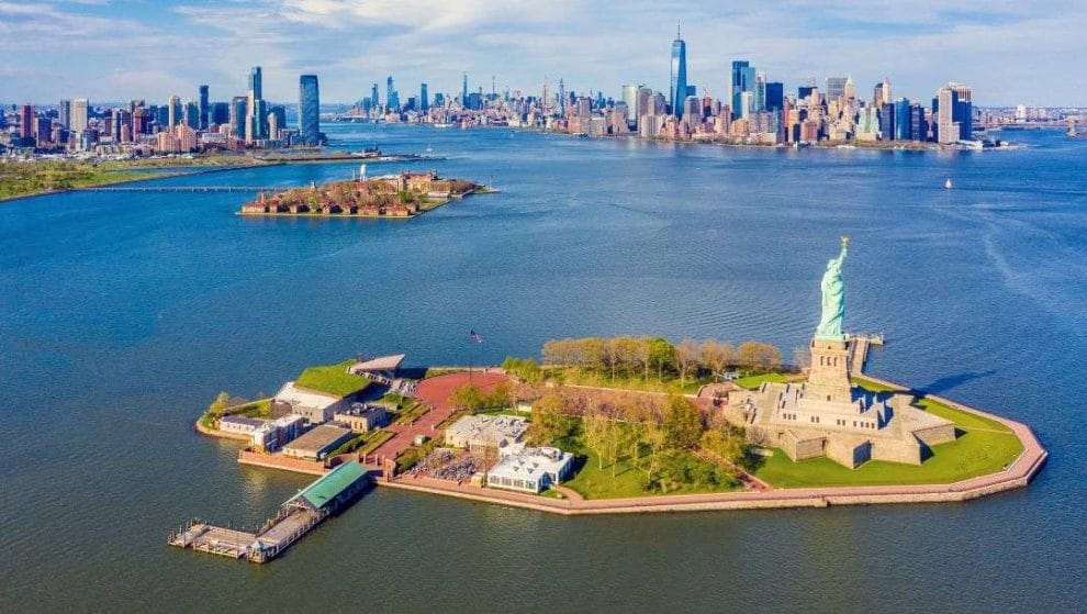 Aerial photograph of Statue of Liberty, Ellis Island and Lower Manhattan Skyline from New York Harbor near Liberty State Park in New Jersey
