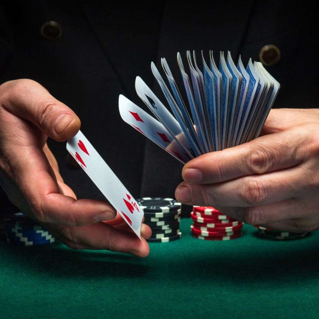A person shuffling cards at a poker