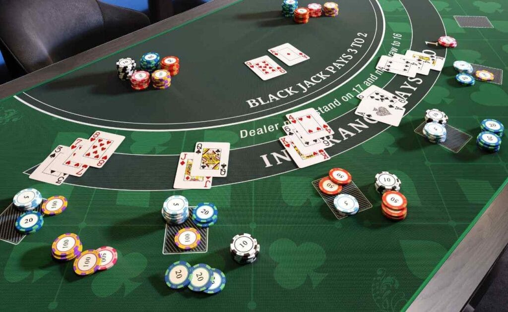Cards and casino chips placed on a blackjack table. 