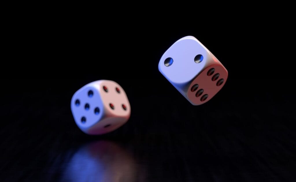 two six-sided dice bouncing on a black surface 