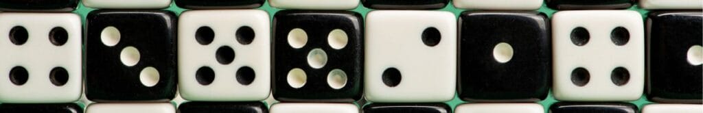 An array of black and white six-sided dice aligned in a neat row