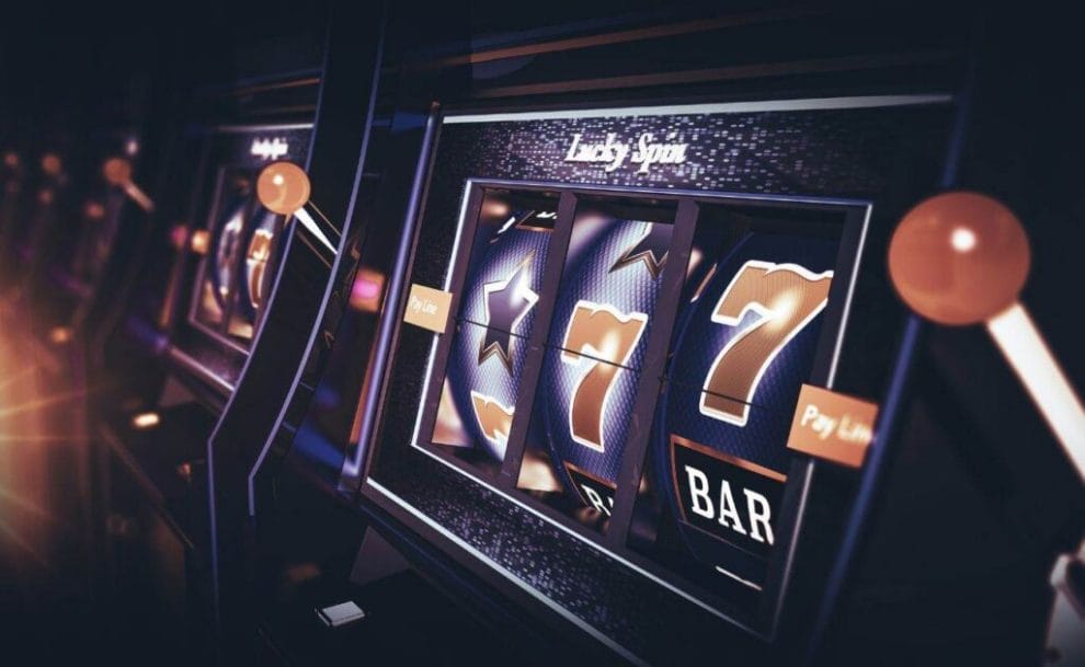A closeup of a black and red slot machine on a casino floor.