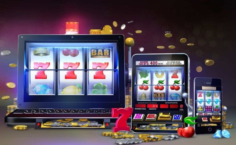 A vector image showing online slot games on a laptop, tablet, and cellphone with coins and slot symbols around the devices.