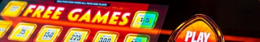 A closeup of the betting options and play button on a modern slot machine.