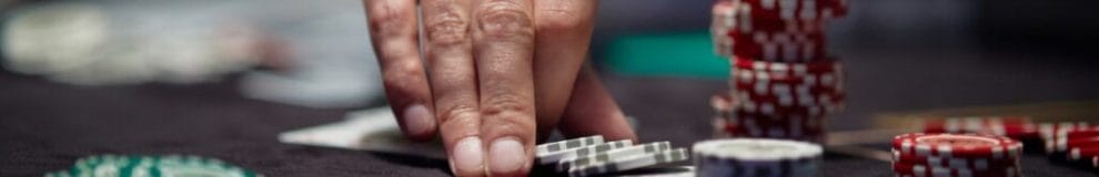 Casino chips on a poker table.