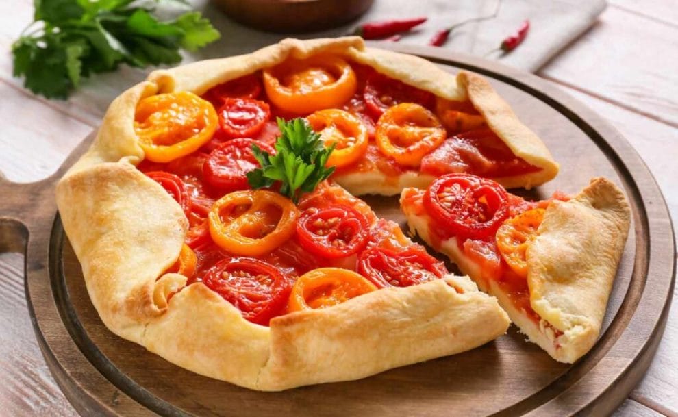 Tomato pie on a wooden board.