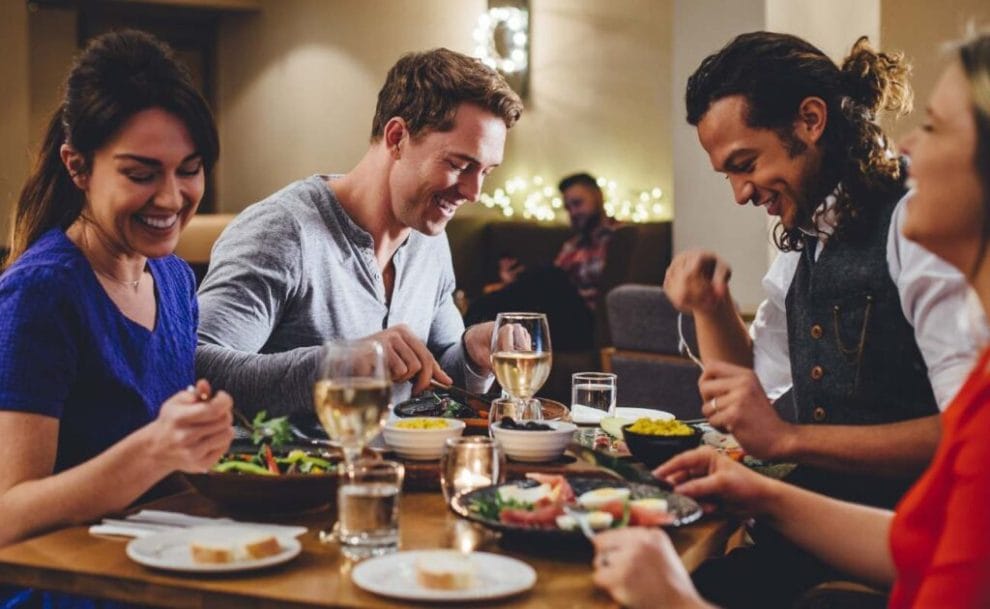 A group of friends having dinner at a restaurant.