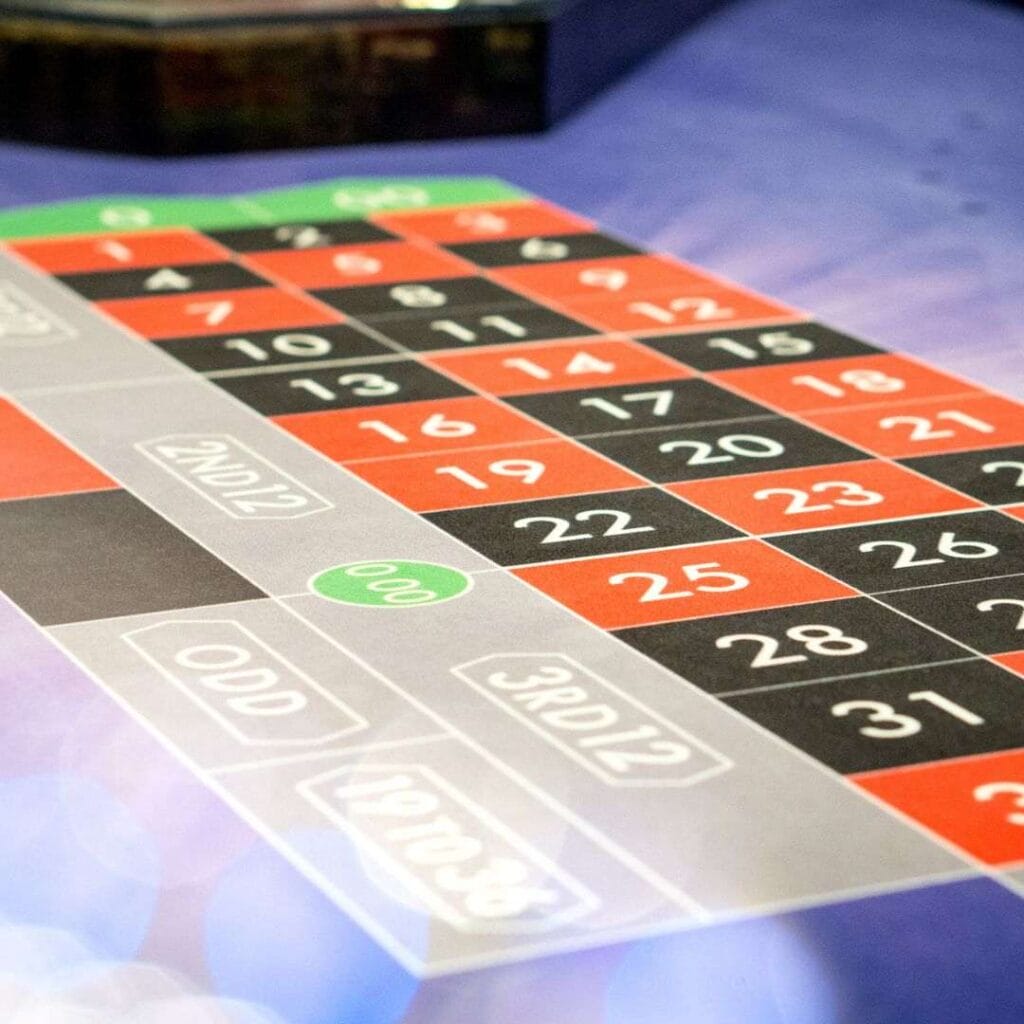 close up of the numbers and bet options on a roulette table
