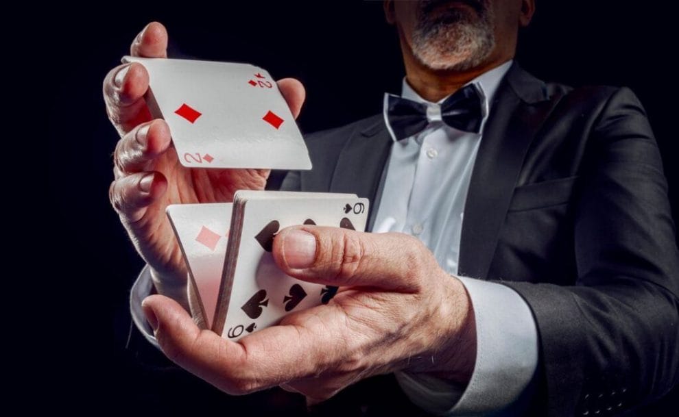 A casino dealer shuffling cards.