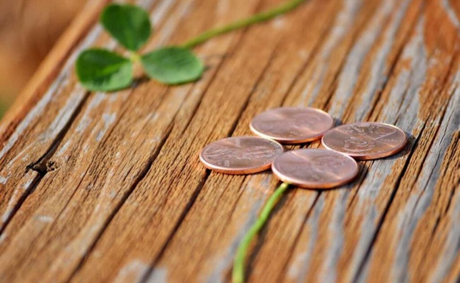A four-leaf clover made of four pennies.