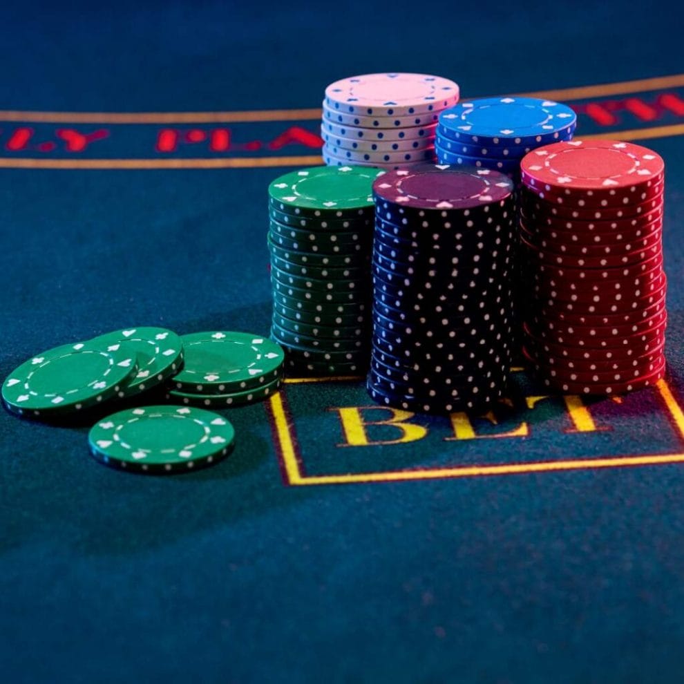 A pile of chips on the bet section of a baccarat table