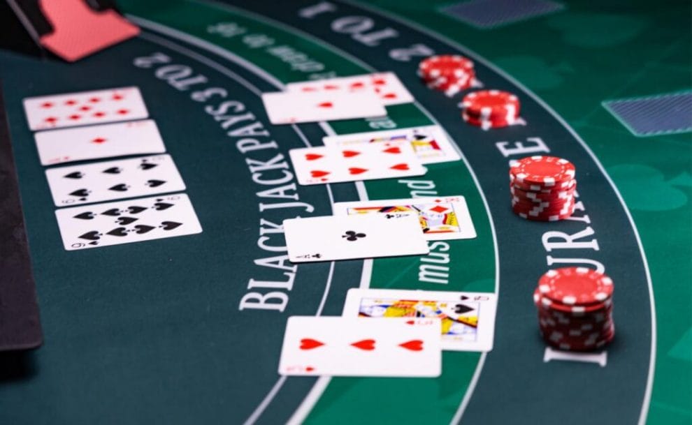 Side-view of cards and chips on a blackjack table.