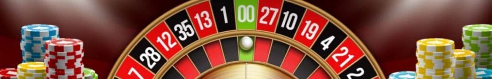 Casino chips next to a digital roulette wheel.
