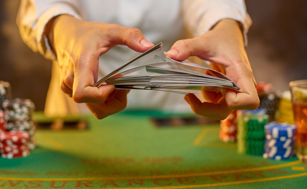 A poke dealer shuffling playing cards.