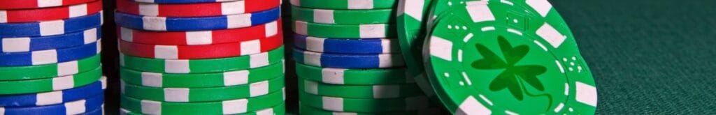 Stacks of poker chips featuring four-leaf clover designs.
