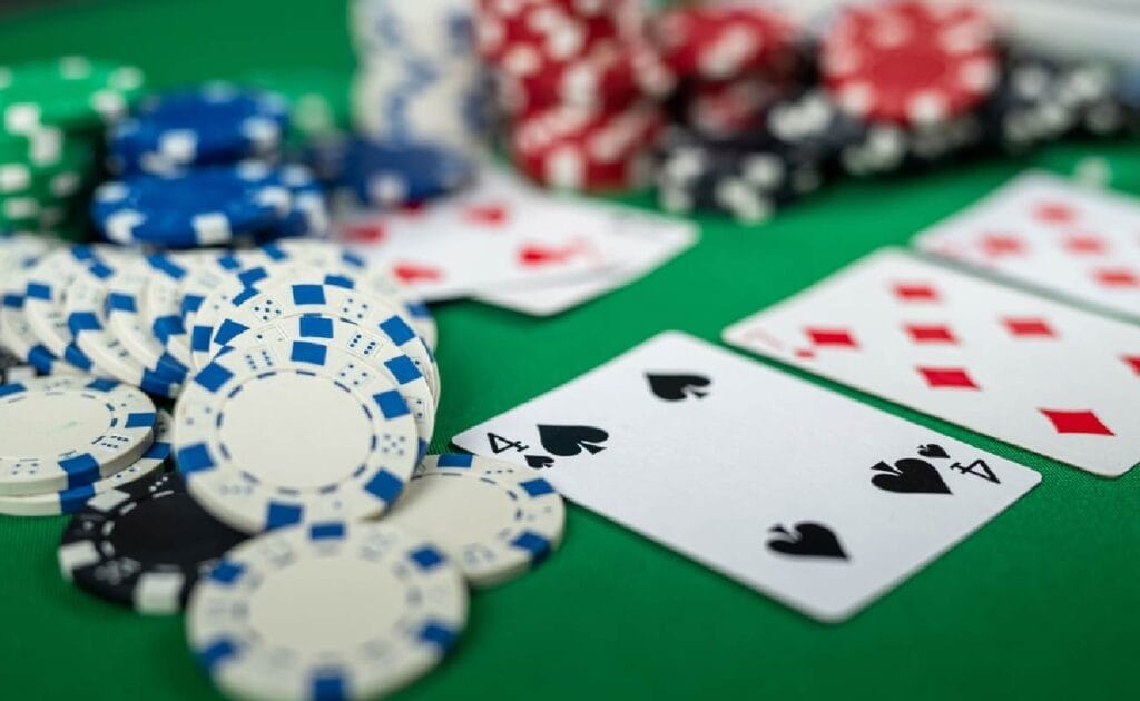 Poker cards laid out on the table with poker chips
