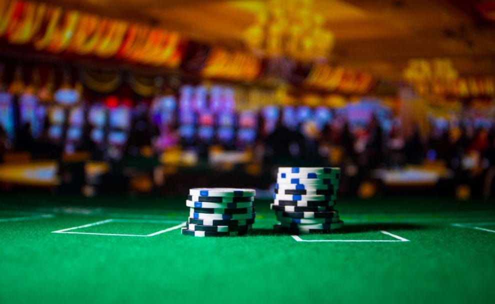 Two stacks of chips on a blackjack table in a casino