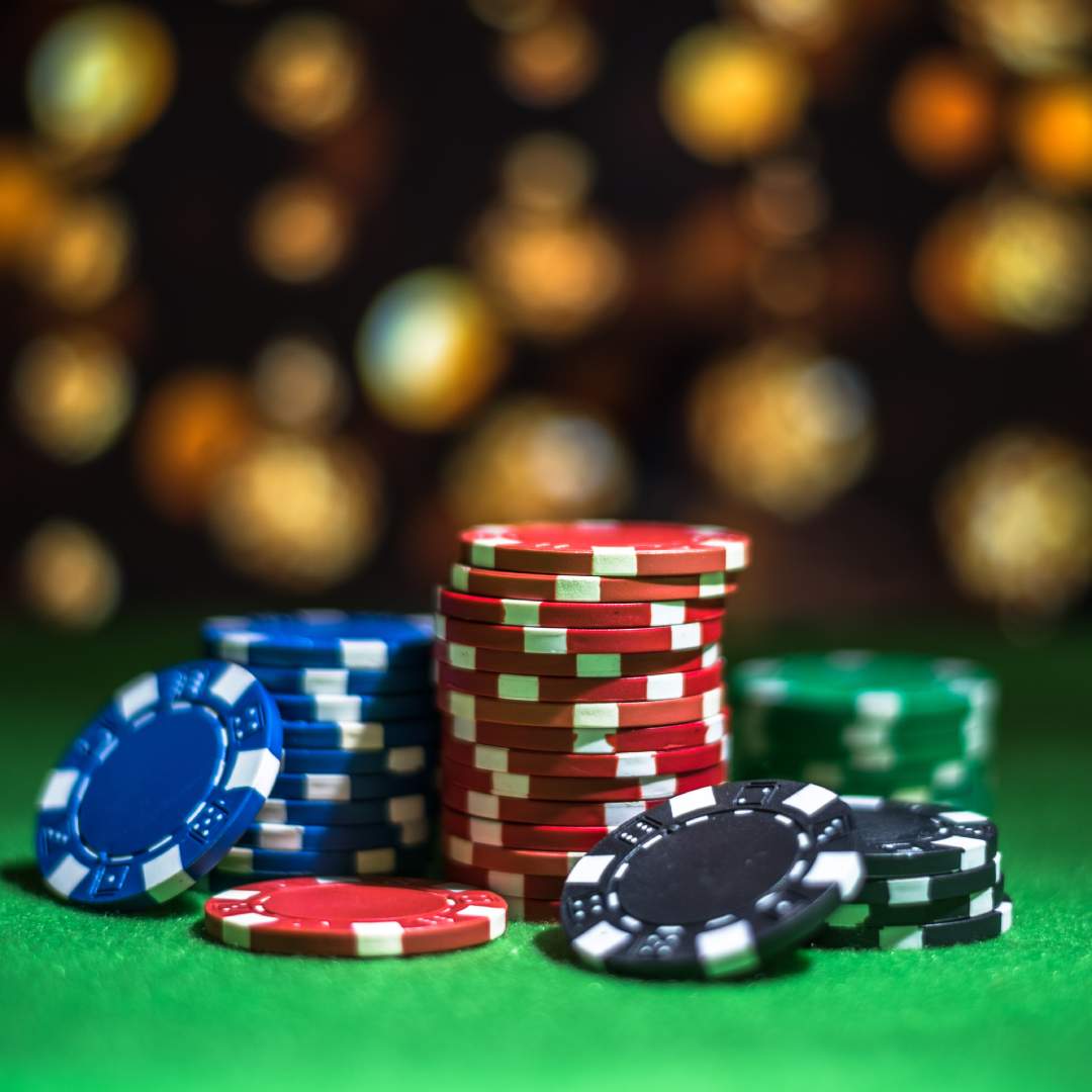 Casino chips on a green felt table.