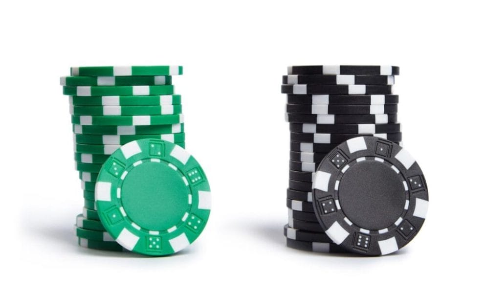 Casino chips on a white surface.
