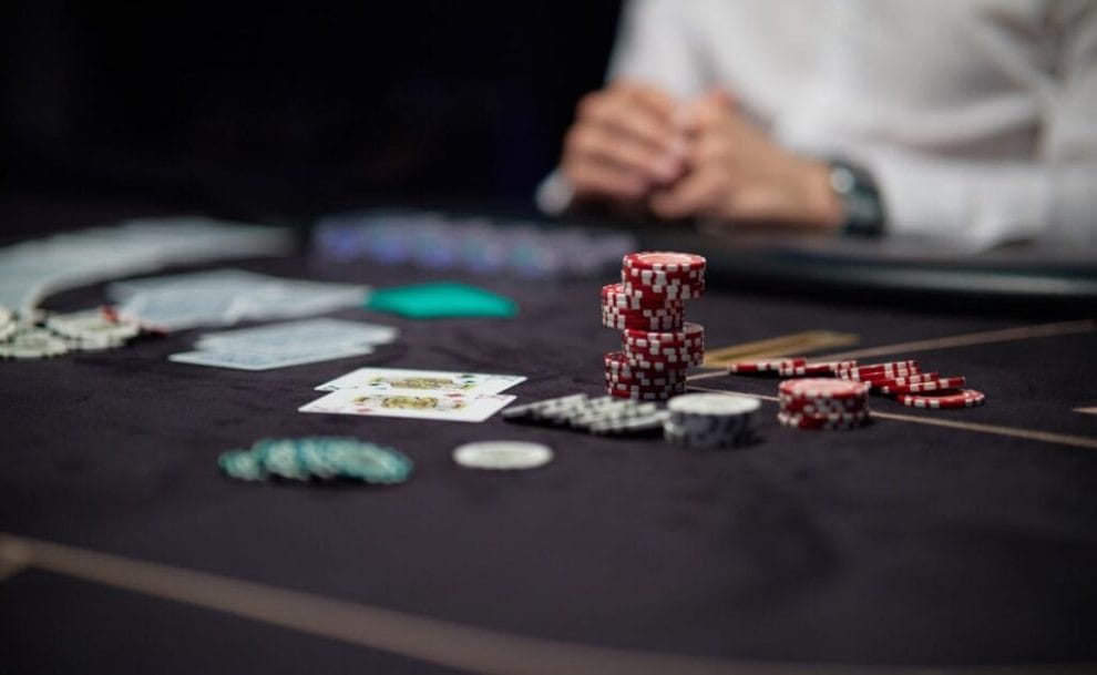 Casino chips on a black felt table.