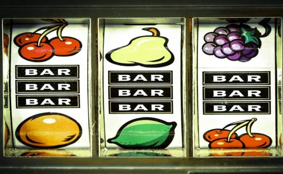 An old slot reel with bar and fruit symbols.
