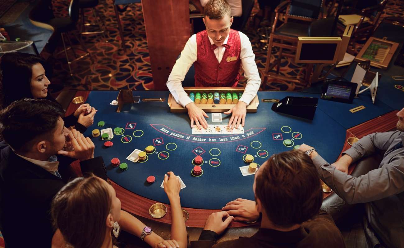 A croupier deals out cards in a game of poker