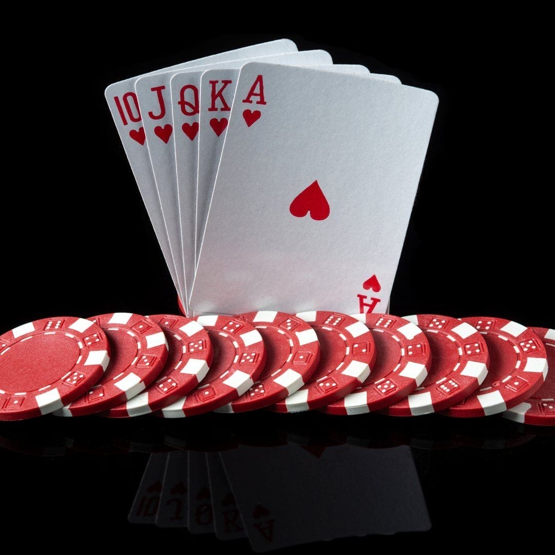 A royal flush against a black background.