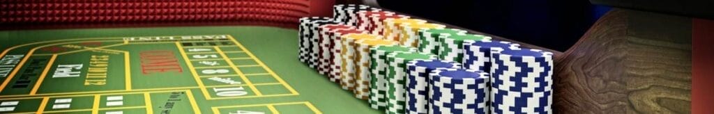 A croupier throws dice onto a blackjack table