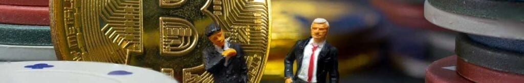miniature businessmen with a bitcoin Coin and casino chips