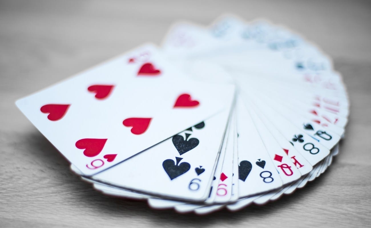 Playing cards deck isolated on a gray wooden background