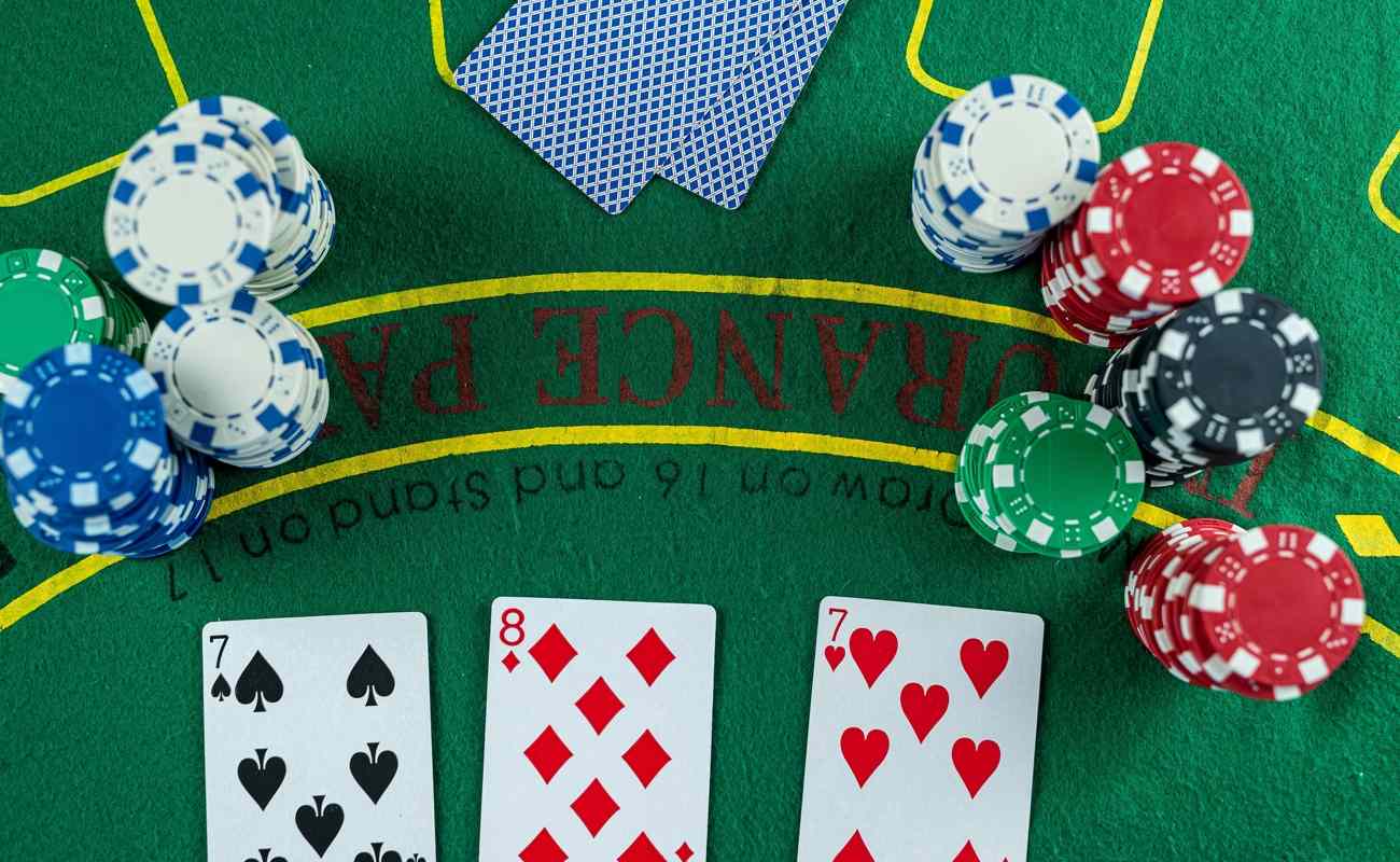 Poker cards with three of a kind or set combination.