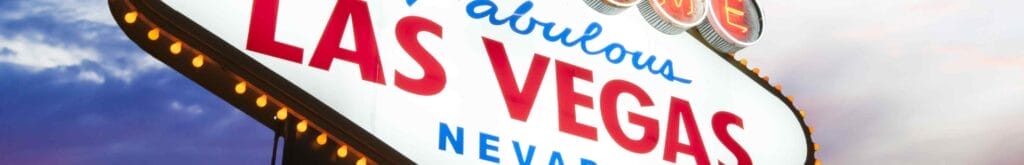 A sign captioned “Welcome to Fabulous Las Vegas, Nevada” against white clouds and a blue sky.