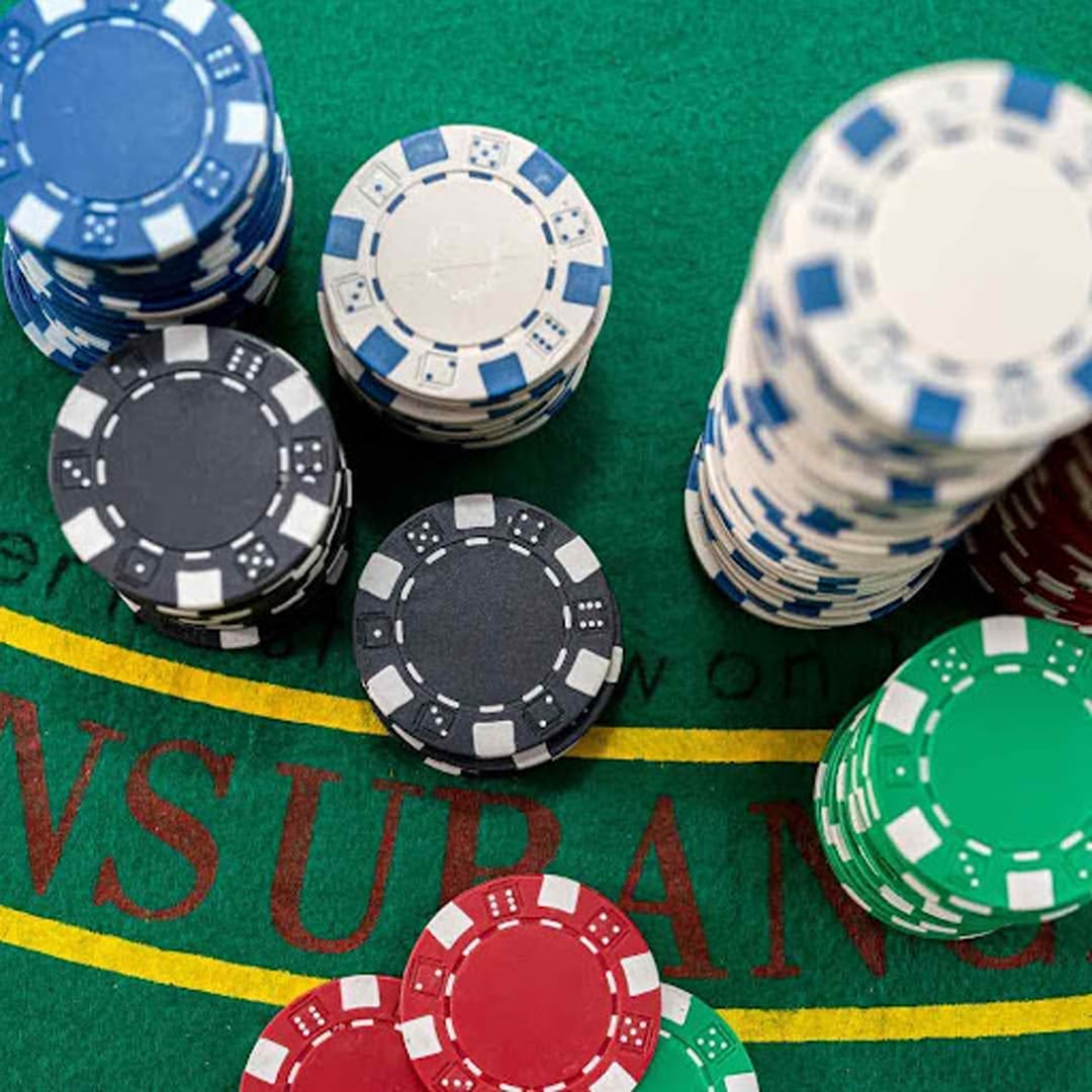 Casino chips on a blackjack table.