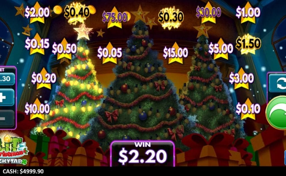 The Lit Christmas screen with three Christmas trees and several wrapped presents sits in front of a fireplace, surrounded by Christmas stars with cash prizes. One Christmas tree is lit up and the player has won a prize.