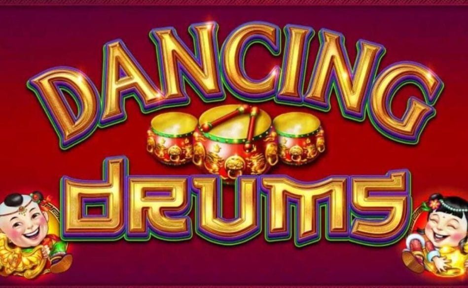 A screenshot of the Dancing Drums slot logo on a red background with three small drums behind it and two Fu Babies at the bottom of the image. 