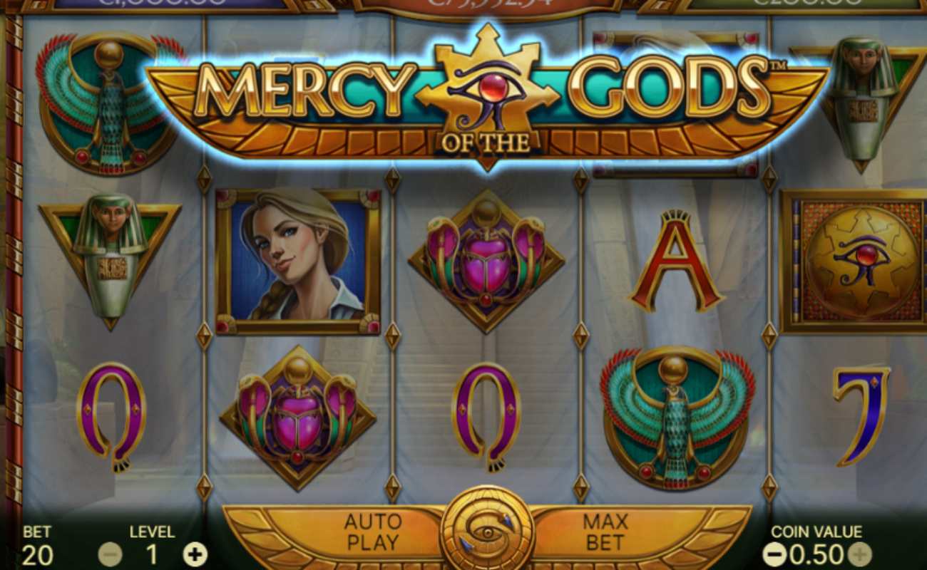 Mercy of the Gods reels feature Egyptian-themed symbols such as the Horus scarab, purple scarab, mummy, and gemstone playing card symbols on a translucent reel.