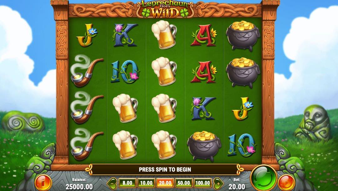 Leprechaun Goes Wild online slot game screen, featuring a 5×4 reel grid with card symbols, pots of gold, smoking pipes, and jugs of beer icons, surrounded by a wooden carved frame in a grassy field with Celtic statues against a cloudy blue sky.