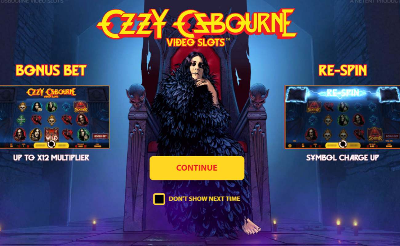 Ozzy Osbourne video slot game with the bonus bet and respin features placed alongside a barefoot Ozzy Osbourne dressed in a blue-black feathery coat. The musician sits on a large, dark, and ornate throne positioned against a dark blue, misty background.