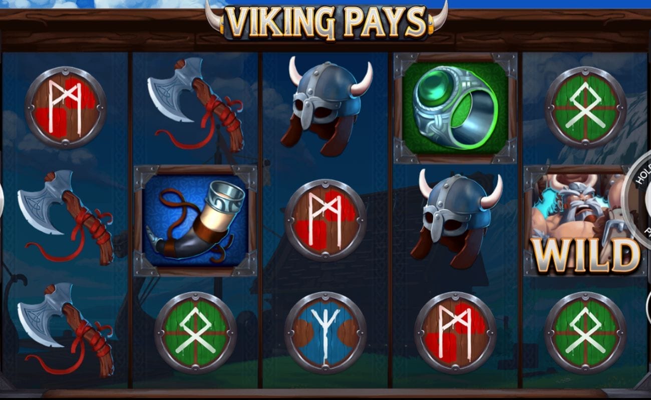 The Viking Pays online slot game screen, featuring a 5×3 grid displaying a hammer, a horn, a warrior helmet, a ring, and various Viking rune icons against the background of a Viking ship.