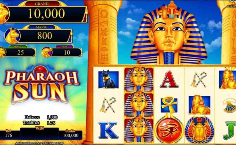 A screenshot of the gameplay of the Pharaoh Sun slot game featuring the game’s logo, jackpots, and betting information on the left, and the slot reels with a golden Pharoah above them on the right of the image.