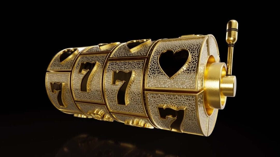 Gold slot machine reel with hearts and sevens on it. The gold reel is against a black background.