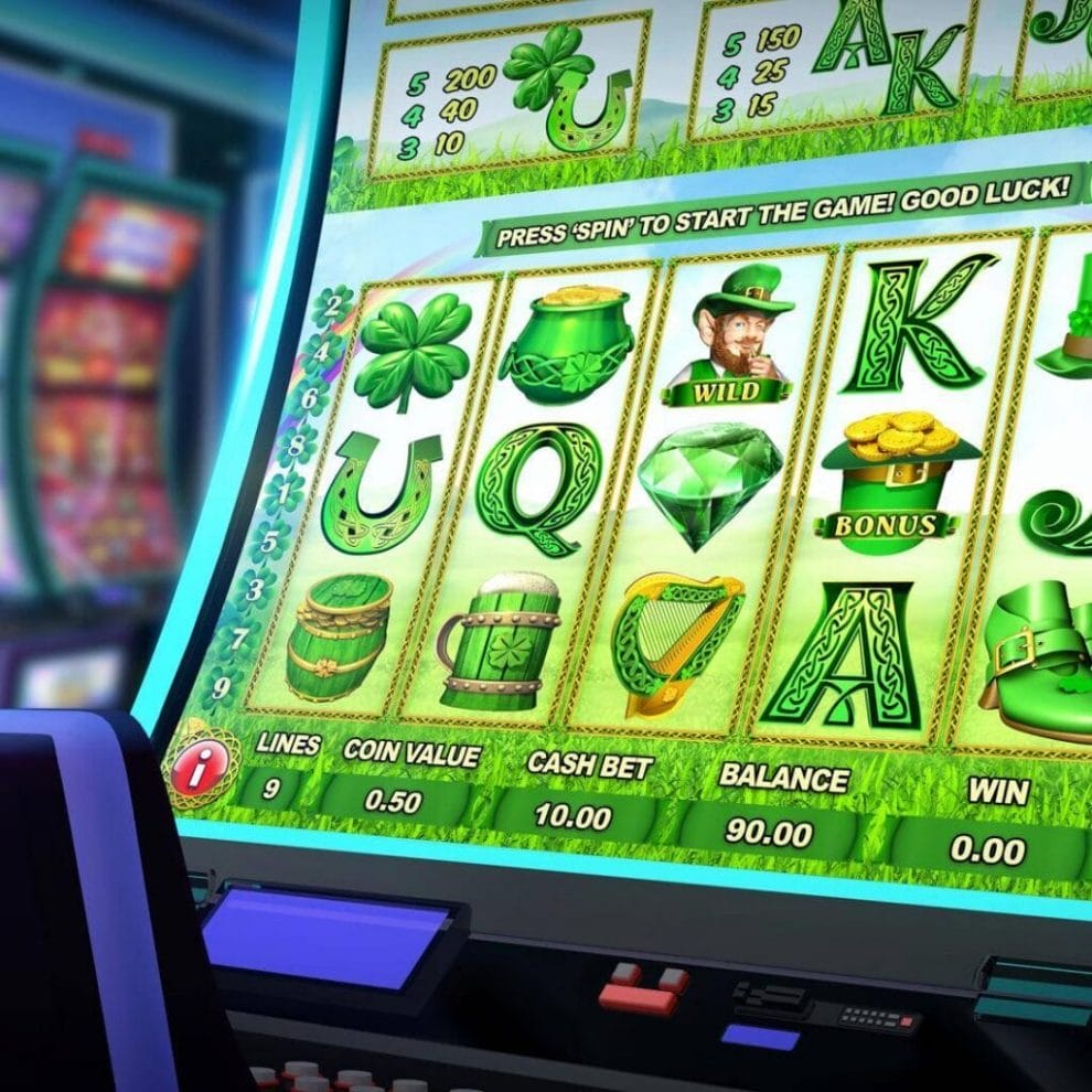 A close-up of an Irish-themed video slot in a casino with a line of other video slots in the background.