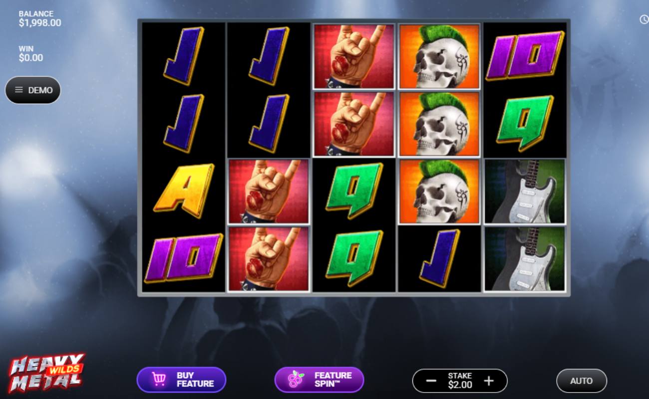Heavy Metal Wilds online slot with playing cards (9, 10, J, and A), an electric guitar, a skull with green hair and a hand. The background shows a silhouette of people at a rock concert.