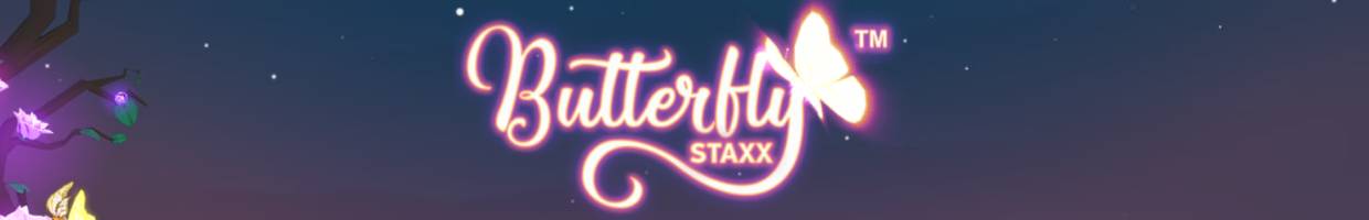 A screenshot of the Butterfly Staxx title screen. The word “Butterfly” is written in cursive with the silhouette of a butterfly that’s sitting on the edge of the letter “y.” The backdrop is a calming dusk sky.