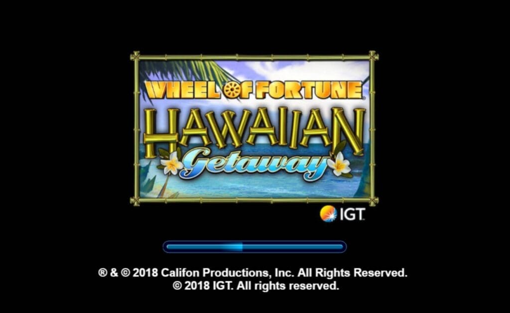 The Wheel of Fortune Hawaiian Getaway online slot logo is in a bamboo frame. The background shows a beach with blue and white skies. The loading bar is blue below the frame. The logo is on a black background.