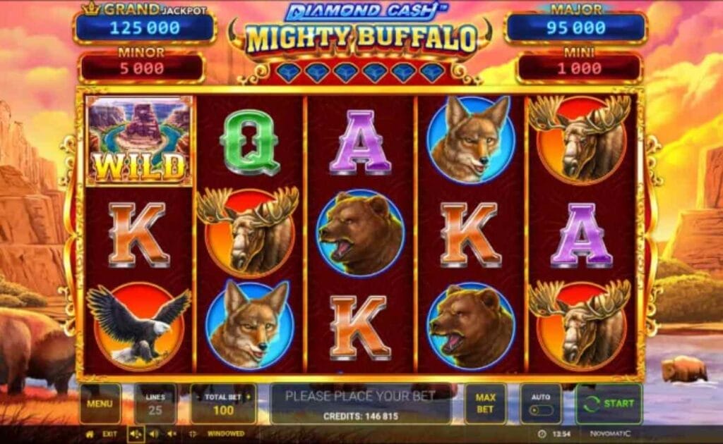 Diamond Cash Mighty Buffalo online slot with an eagle, fox, moose, bear, and playing cards (K and A) on the maroon reels. The background shows American wilderness with mountains, a river, and bears at sunset.