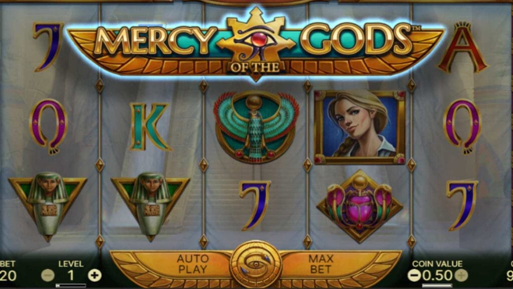 Mercy of the Gods online slot with ancient Egyptian-themed symbols. The reels are translucent and shows the entrance to a tomb.